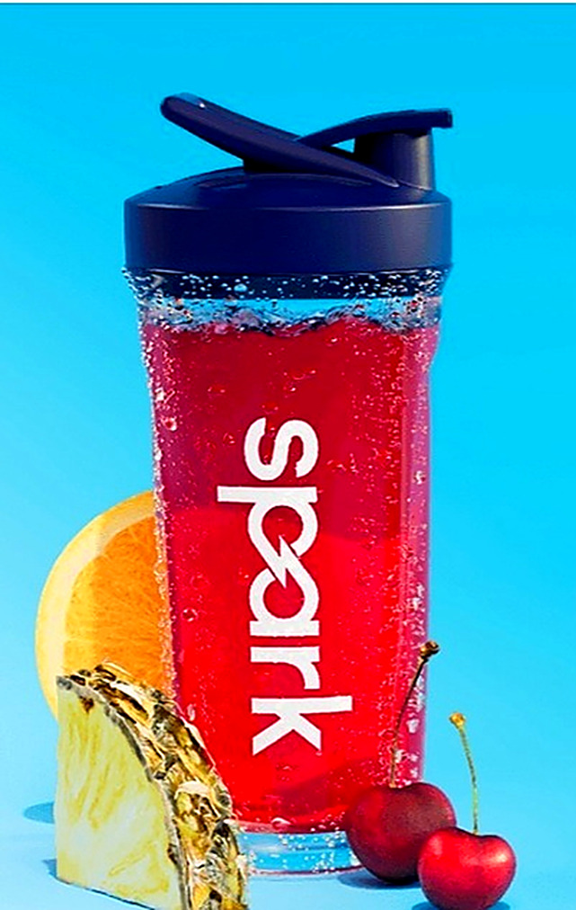 Spark shaker bottle with fruit slices and cherries